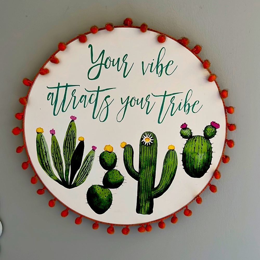 “Your vibe attracts your tribe” sign